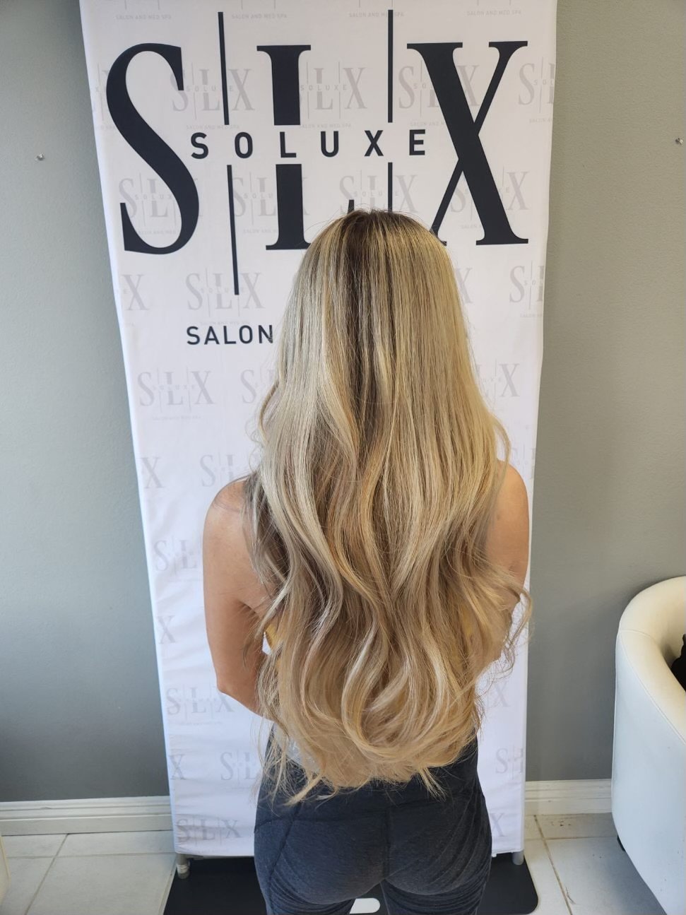 Long blonde waves styled at Soluxe